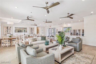 Living room with crown molding and light tile patt
