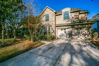 3 car tandem garage with double wide driveway.