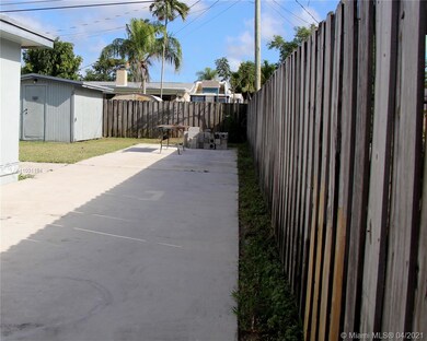 Paved side driveway to store a Boat and RV.