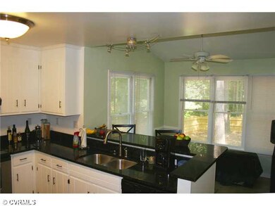 Kitchen - Sleek granite counters.new stainless ste