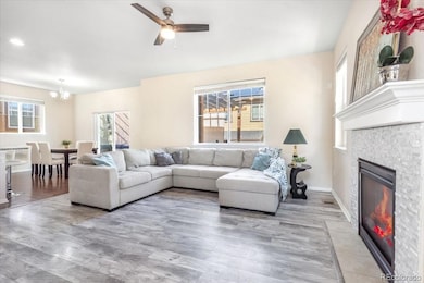 Living room w/gas fireplace and ceiling fan