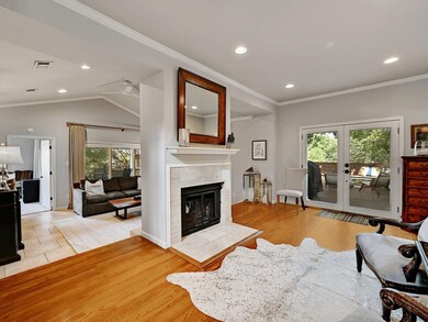 Living room with recessed lighting, a fireplace, 