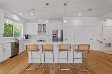 From the kitchen, you can stay connected to the living area — whether you’re hosting friends or just keeping an eye on the game.