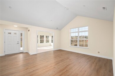 and living room view into sunroom