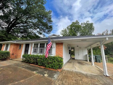 View of front facade with a carport