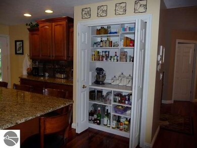 This pantry doubles as an appliance garage with a 