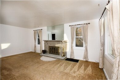 Living Room with wood-burning fireplace