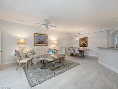 Living room with light wood-type flooring and ceil