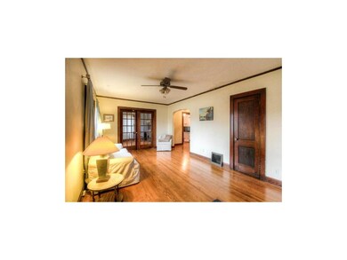 Living Room with French Doors to Bedroom 2 or Offi