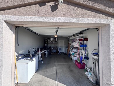 Garage featuring refrigerator