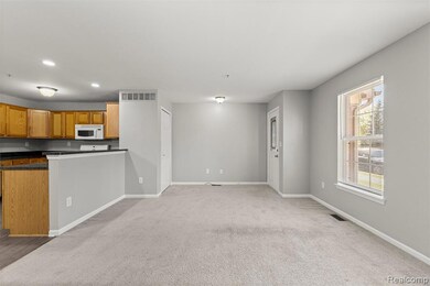 Unfurnished living room featuring light carpet and recessed lighting