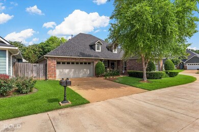 View of front facade featuring a garage and a fron