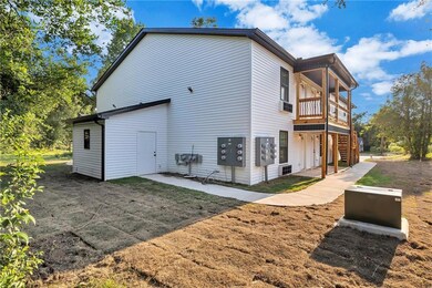 View of property exterior featuring stairway and a patio area