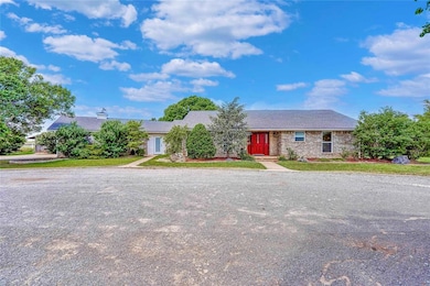 Single story home with brick siding
