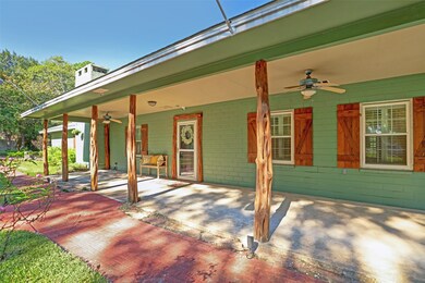 Gorgeous wooden shutters and cedar posts make this