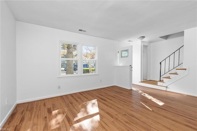 Spacious front room is bright and inviting.