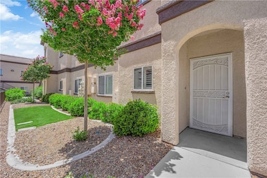 Entrance to property with stucco siding