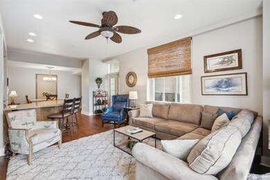 Living room with dark wood-type flooring and ceili