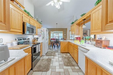 Well appointed kitchen with solid surface counters