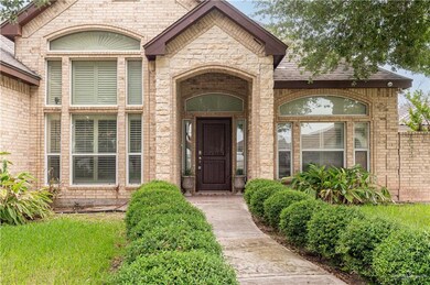 View of exterior entry featuring brick siding