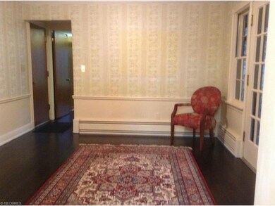 Charming dining room offers wainscoting and  crown