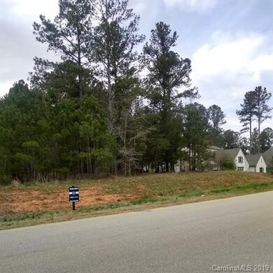 Left to right view of lot, and next door neighbor'