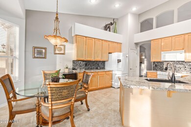 Bright kitchen with granite countertops.