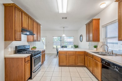 As you move from dining to kitchen, you’ll pass no