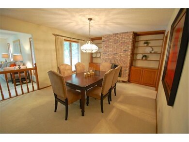 Separate formal dining room includes a wood burnin
