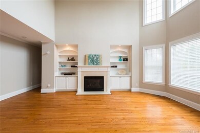 Two story great room with gas fireplace. The guest