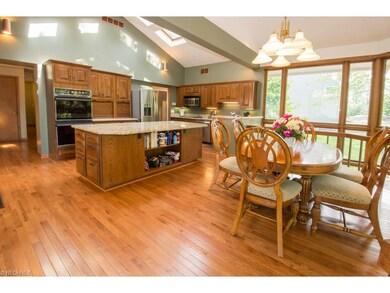 Bright and sunny oversized kitchen with 8 skylight