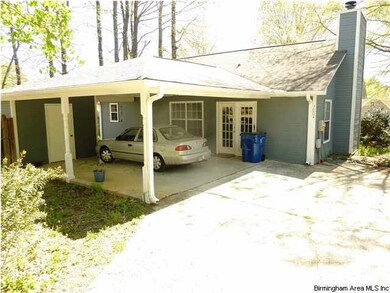 Driveway and carport, as seen from the rear entrac