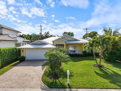 View of front of house with a porch, a garage, and