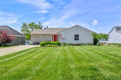 Lakefront ranch with flat driveway & yard!