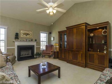 Den/Family/Great Room. The great room boasts vaulted ceilings, a gas log fireplace, ceiling fan lighting and chair rail molding.