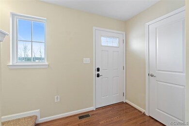 Foyer with hardwood flooring