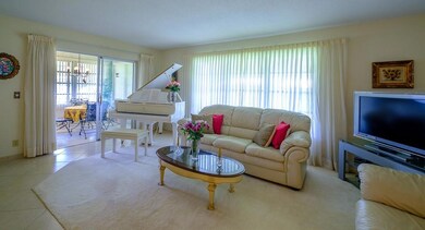 Spacious Living Room with Tile and Carpet.