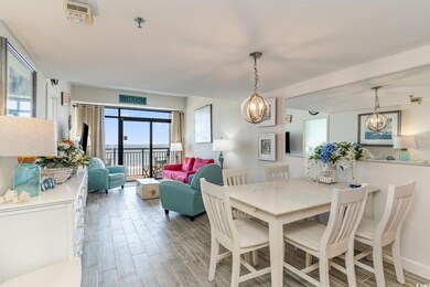 Dining space featuring a chandelier, light wood-ty