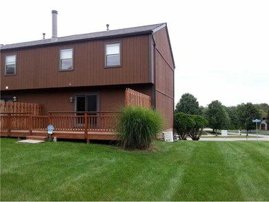 Exterior Back. End unit with large deck. Home back