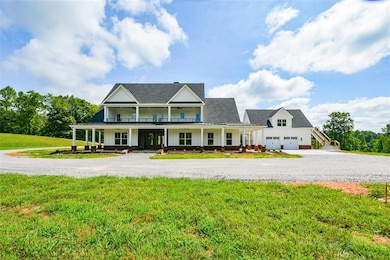 View of front of house with covered porch and a fr