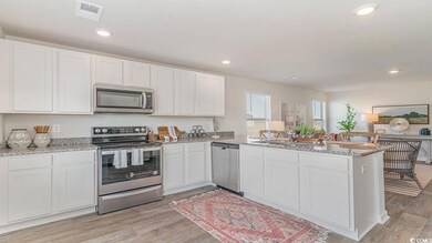 Kitchen featuring light hardwood / wood-style floo