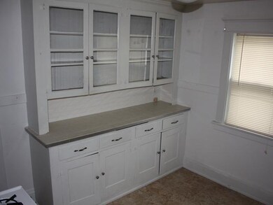 Kitchen Bright white with newer floors and counter