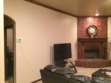 Living Room. Spacious 17x17 with wood burning fire