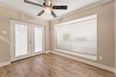 Dining area with ceiling fan leads to the patio