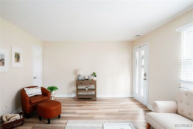Tons of natural light.  Coat closet beyond chair