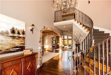 Foyer entry - custom wood floor, stair rails are c