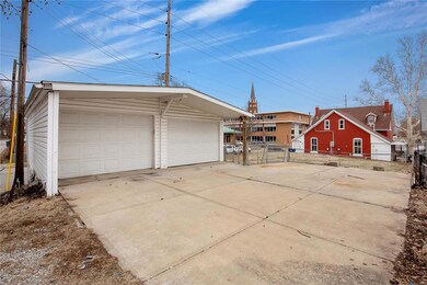2 car garage and large parking pad.