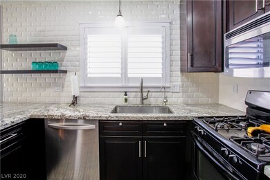 LOTS OF STORAGE AND PRETTY GRANITE COUNTER TOPS. N