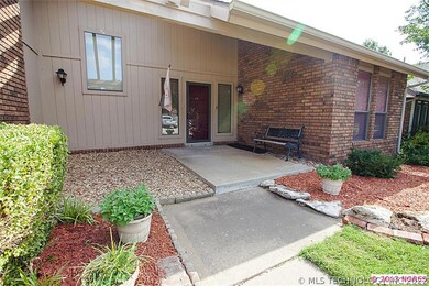 The welcoming, covered front entry is large and op