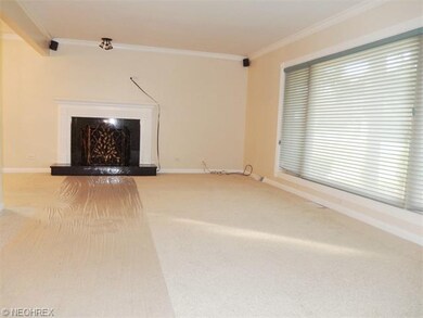 Living room with gas log fireplace.